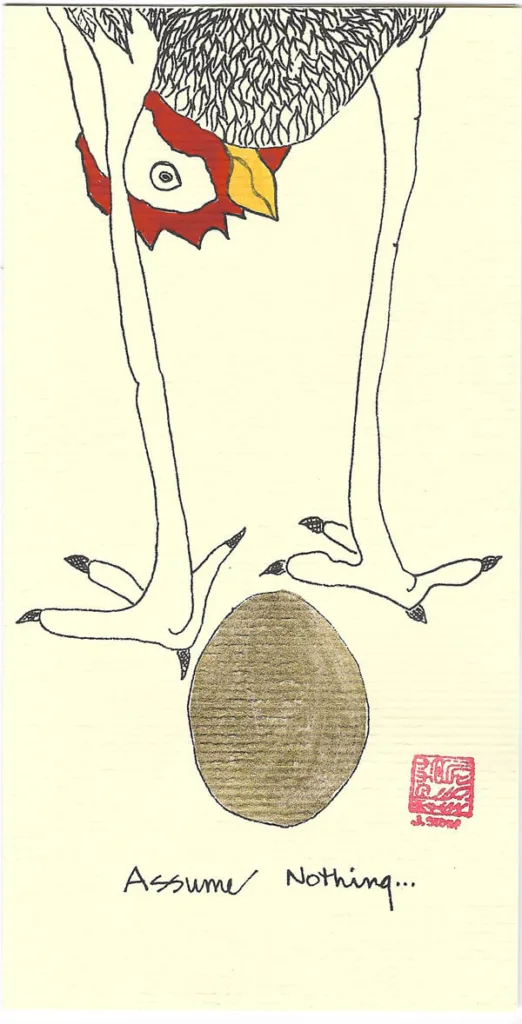 A greeting card featuring a chicken laying a gold foil egg. It says "Assume Nothing"